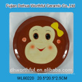 Round ceramic plate with monkey design